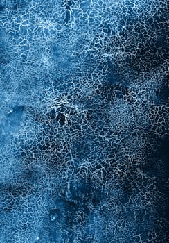 Classic blue colored texture with cracks. Surface with craquelure effect.