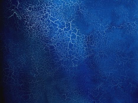 Dark blue texture with silver cracks. Surface with craquelure effect.