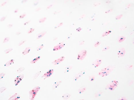Abstract background with glitter stains with shiny sparkling rhinestones. Pink backdrop.