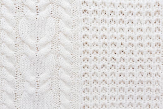 Abstract knitted background. Wool white sweater texture. Close up picture of knitted pattern.