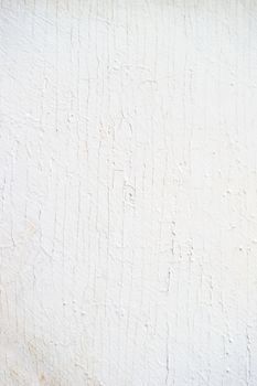 Wooden background of old fence with rusty nails. Shabby texture of white colored wooden boards.