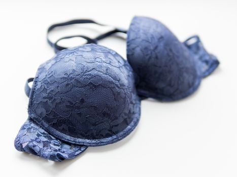 Blue lace bra on white background. Elegant underwear.