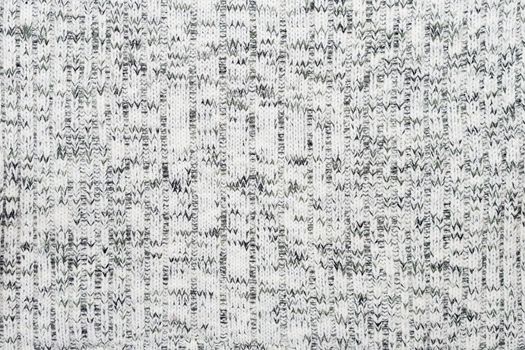 Abstract knitted background. Wool sweater texture. Close up picture of knitted pattern.