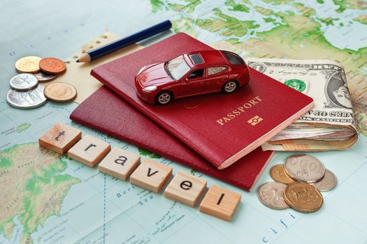 Travel background with passport, money, map and notes. Word TRAVEL and symbol of car travel - car model.