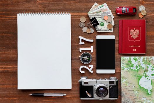 Travel background 2017 year. Different things you need for journey - smartphone, passport, camera, map, money. Symbols of car trip in 2017 year. Place for text.
