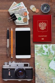 Travel background. Different things you need for journey - smartphone, passport, camera, map, money.