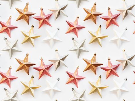 Seamless pattern. New Year background with decorative stars. Colorful decorations for Christmas tree.