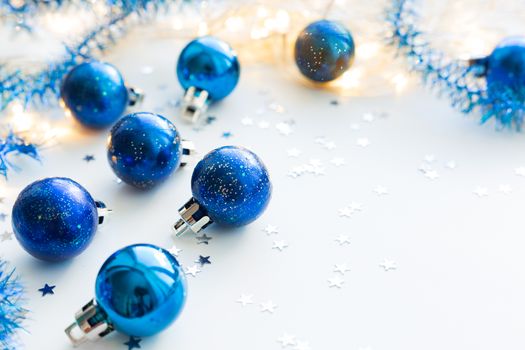 Christmas and New Year background with blue decorative balls for Christmas tree. Place for text.