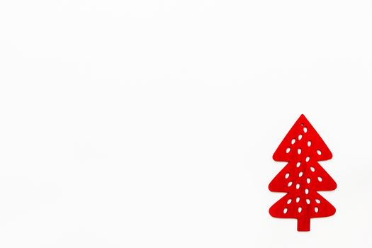 Wooden red fir tree, Christmas and New Year decoration. Flat lay on white background, top view. Place for text.