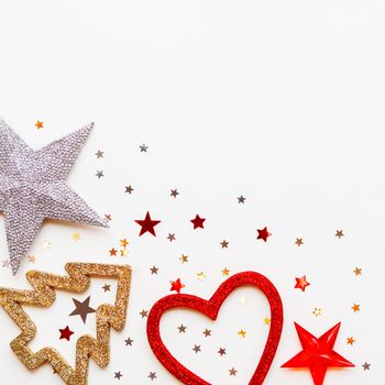 Christmas and New Year background with decorations - shiny stars, balls, snowflakes, heart, confetti.