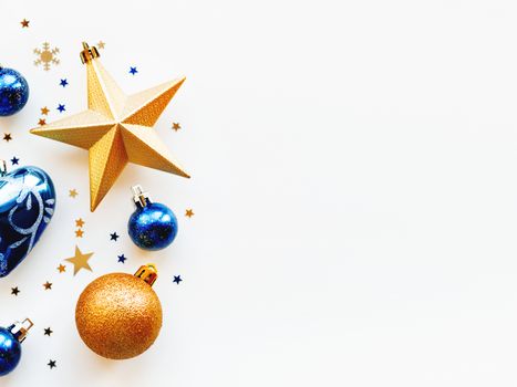 Christmas and New Year 2020 background with decorations, shaped as a circle. Golden and blue balls, stars, confetti and heart.