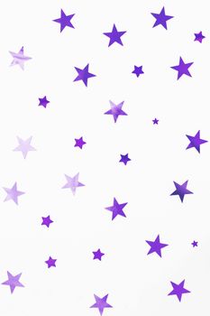 Holiday background with violet star confetti. Good background for Christmas and New Year cards.