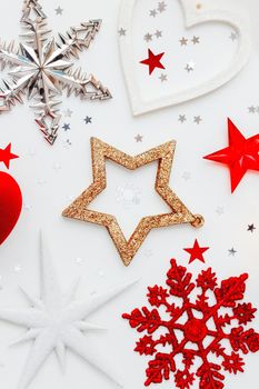 Christmas and New Year holiday background with decorations and red gift heart box. Top view, flat lay.