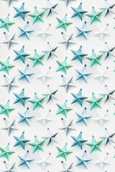Seamless pattern. New Year background with decorative stars. Colorful decorations for Christmas tree.