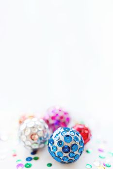 Christmas and New Year background with bright balls. Hand made decorations for Christmas tree with colorful sparkling spangles. Place for text.
