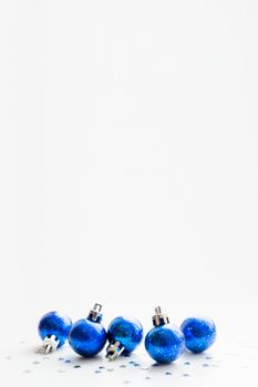 Christmas and New Year background with blue starry decorative balls for Christmas tree. Place for text.