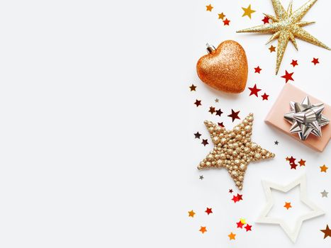 Christmas and New Year background with sparkling fir tree, Santa Claus, heart, snowflakes and star confetti. Holiday decorations on white background.