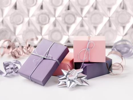 Holiday presents. Gifts wrapped in pale pink and violet paper with silver ribbons. Sparkling silver and lilac bows.
