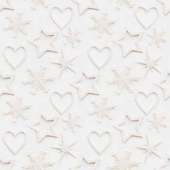 Seamless pattern with decorative stars, snowflakes, hearts. Christmas decorations on white background. New Year concept, photo pattern.