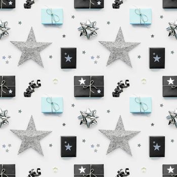 Photo seamless pattern with holiday presents. Gifts wrapped in pale cyan and black paper with silver ribbons and bow. Stars confetti. Top view, flat lay.