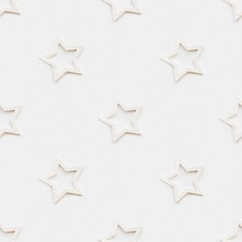 Seamless pattern with decorative stars. Christmas decorations on white background. New Year concept, photo pattern.