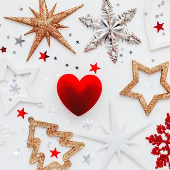 Christmas and New Year holiday background with decorations and red gift heart box. Top view, flat lay.