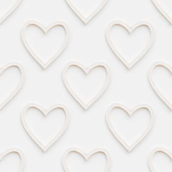 Seamless pattern with decorative hearts. Christmas or Valentine's Day decorations on white background. Symbol of love, photo pattern.