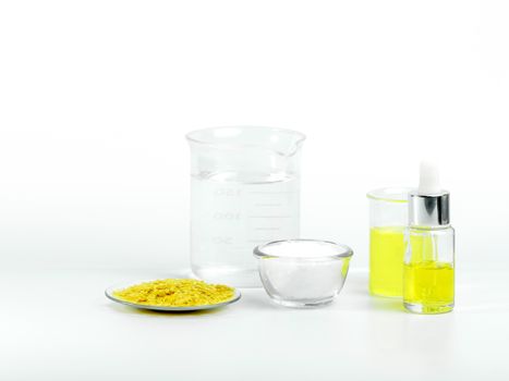 Cosmetic chemicals ingredient on white laboratory table. Polyaluminium Chloride, Carnauba wax flakes sp-200, Nickle chloride liquid, Microcrystalline wax, alcohol