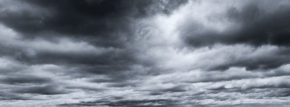 Dark dramatic sky and clouds. Background for death and sad concept. Gray sky and fluffy white clouds. Thunder and storm sky. Sad and moody sky. Nature background. Dead abstract background. Cloudscape.