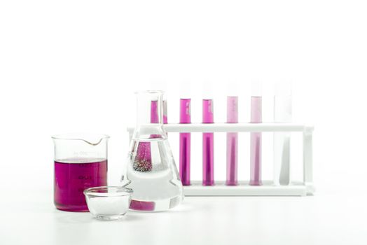 Cosmetic chemicals ingredient on white laboratory table. Potassium Permanganate Liquid,  Alcohol, Microcrystalline wax.