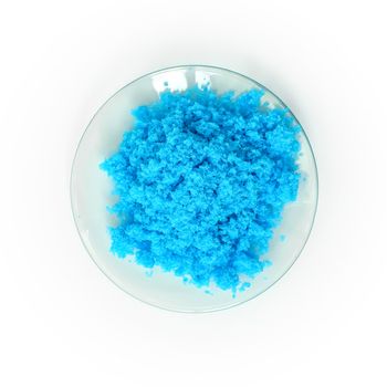 Close up inorganic chemical on white laboratory table. Copper(II) sulfate, a common chemical used in medical and public health issues.