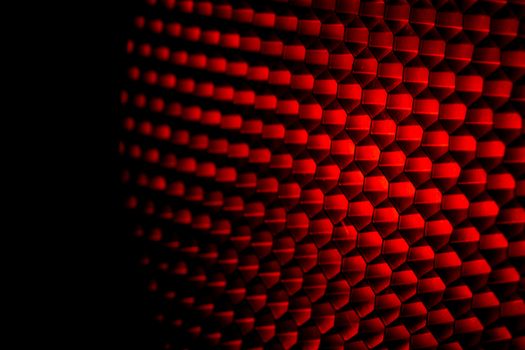 Closeup honeycomb grid texture with red light. Red and dark metal hexagon shaped pattern abstract background. Light modifier equipment. Metal honeycomb. Futuristic pattern. Honey grid cells network.