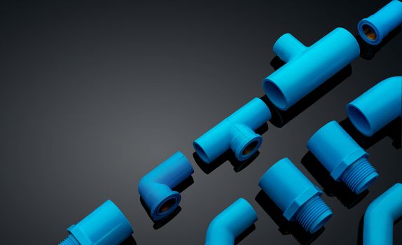 Set of blue PVC pipe fittings isolated on dark background. Blue plastic water pipe. PVC accessories for plumbing. Plumber equipment. Bend and three way connection plastic pipe for water drain sewage.