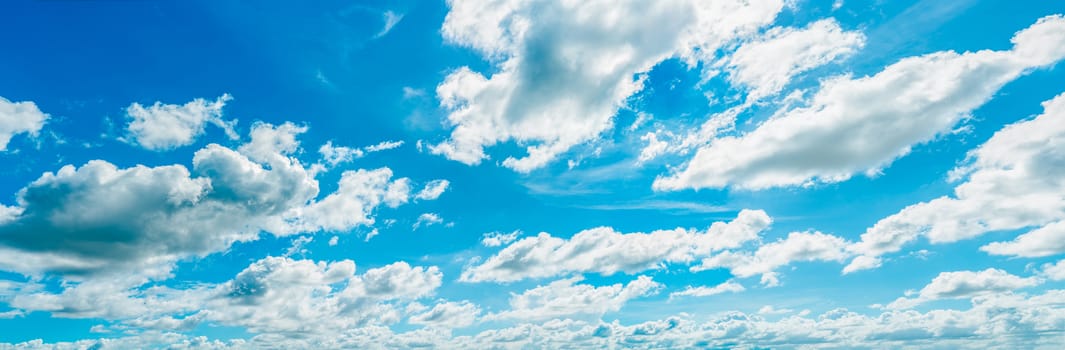 Beautiful blue sky and white cumulus clouds abstract background. Cloudscape background. Blue sky and fluffy white clouds on sunny day. Nature weather. Bright day sky for happy day background. 