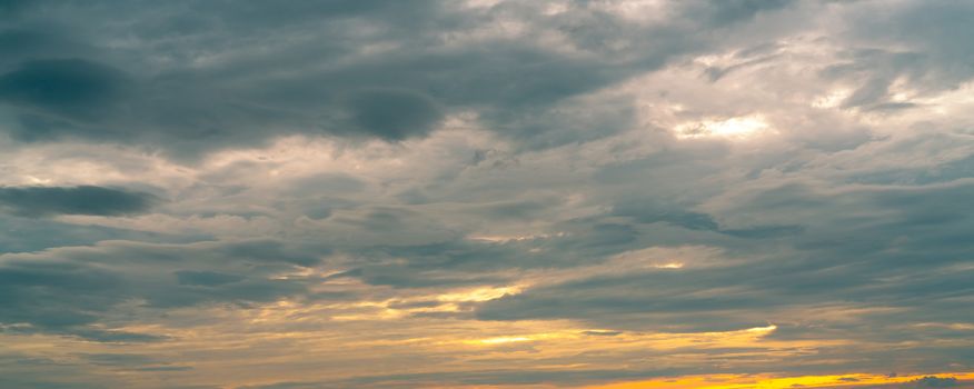 Morning sunrise sky and white clouds. Beautiful golden sunrise sky with white fluffy clouds. White fluffy cloudscape abstract background. Beauty in nature. Dramatic heaven sky. Art picture background