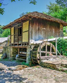 Gabrovo, Etar, Bulgaria - 07.27.2019. Water mill in the Etar Architectural Ethnographic Complex in Bulgaria on a sunny summer day. Big size panoramic photo.