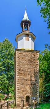 Gabrovo, Etar, Bulgaria - 07.27.2019. Clock tower in the Etar Architectural Ethnographic Complex in Bulgaria on a sunny summer day. Big size panoramic photo.