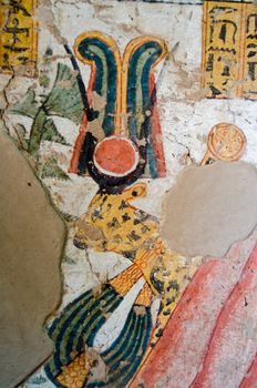 Painting of a cheetah wearing the crown of the goddess Hathor on the wall of an Ancient Egyptian tomb on the West Bank of the Nile at Luxor, Egypt.  Painting thousands of years old.