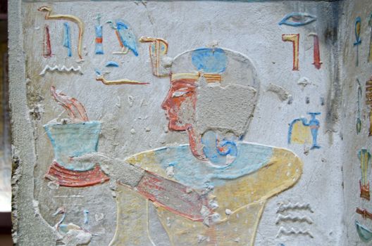 Ancient Egyptian painting of Prince Titi holding a pot of sacred fire in his tomb in the Valley of the Queens, Luxor, Egypt.  