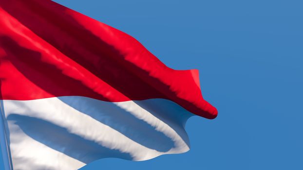 3D rendering of the national flag of Indonesia waving in the wind against a blue sky