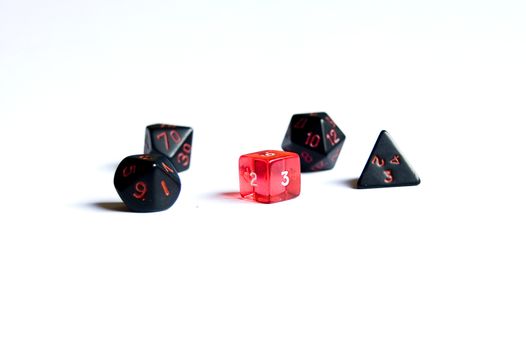 small various dice lying on a white isolated background