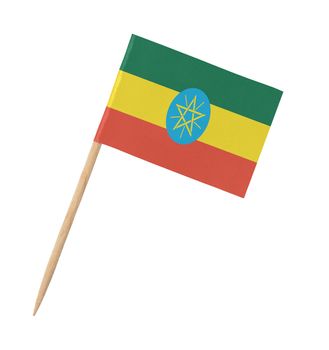 Small paper flag of Ethiopia on wooden stick, isolated on white