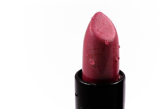 beautiful red lipstick in a black body on a white isolated background