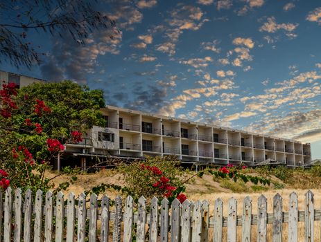 Abandoned Hotel Construction Beyond Picket Fence