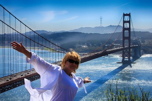 Girl tourist on the background of the Golden Gate Bridge in San Francisco.