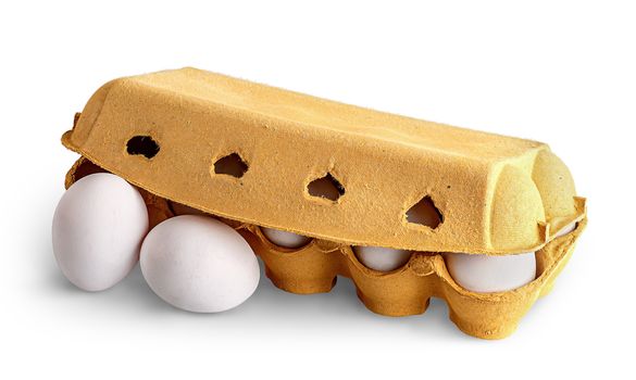 Closed cardboard egg tray and two eggs in front isolated on white background