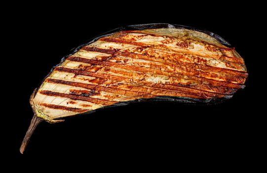 Grilled eggplant on a black background, top view.