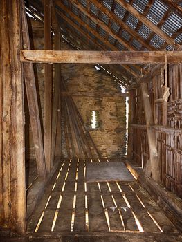 Interior view of old bank barn with stone walls