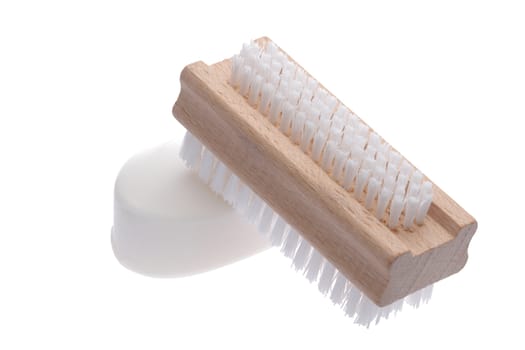 A Nail brush and white pure soap isolated on white
