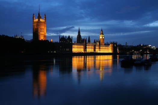 Dusk view of the Houses of Parliament and the River Thames
